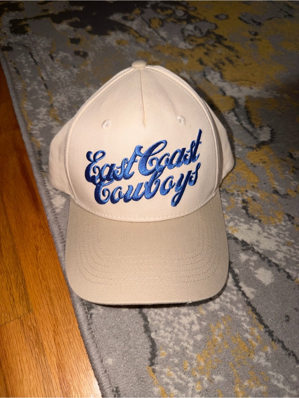East Coast Cowboys Embroidered Baseball Cap - Cream with Blue Script